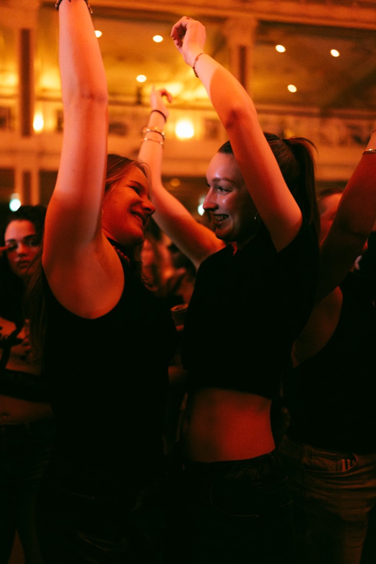 Crowd with hands raised during an Out of the Box night at the Kurhaus